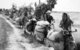 Vietnam: NLF (Viet Cong) porters taking supplies to the front near Saigon by bicycle, 1972